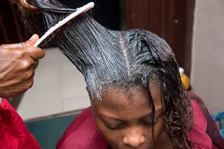 Hair Relaxer Lawsuits 2024 Woman Getting Hair Relaxed