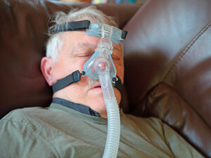 Philips CPAP Class Action Lawsuit Update May 2024 Tired Senior Taking Nap