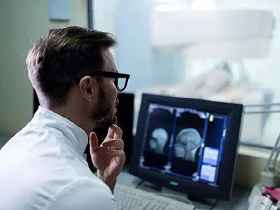 radiologist examines MRI of depo provera patient brain scan